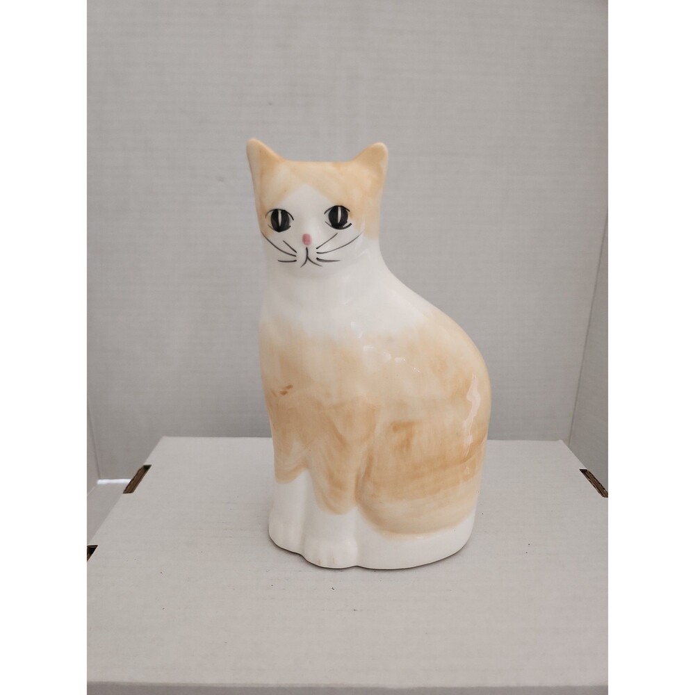 Orange and white ceramic cat figurine home decor accent
